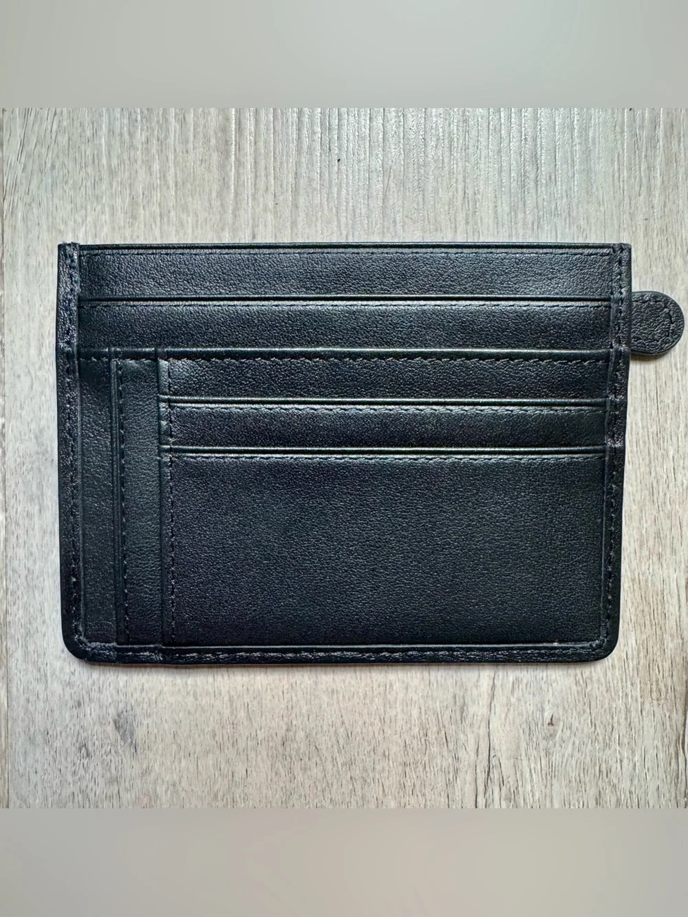 Kinzd minimalist leather card holder by Kinzd, featuring a zippered compartment